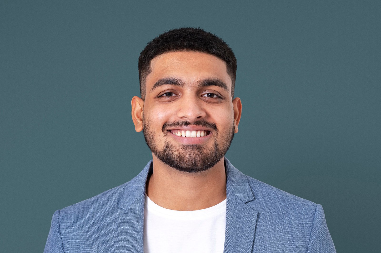 Cheerful Indian businessman smiling closeup portrait for jobs and career campaign